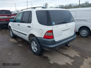1999 Mercedes-Benz M-Class with VIN 4JGAB54E3XA141663, listed as a IAAI auction lot 41886982 with 196,503 mi miles. Bid and sale history available at carsss.com. Image 3.