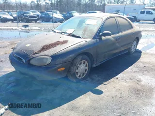 1997 Mercury Sable GS with VIN 1MELM50U7VA656293, listed as a IAAI auction lot 41651281 with 136,024 mi miles and . Bid and sale history available at DreamBid. Image 2.