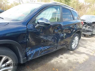 2015 Mazda CX-5 Grand Touring with VIN JM3KE4DY7F0478823, listed as a IAAI auction lot 40731626 with 82,884 mi miles. Bid and sale history available at carsss.com. Image 6.