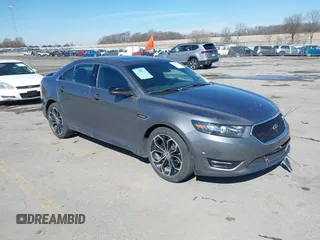 2013 Ford Taurus SHO z VIN 1FAHP2KT0DG220825, wystawiony jako IAAI lot #41851095 z przebiegiem 163 797 mil mil oraz . Historia ofert i sprzedaży dostępna na DreamBid. Obrazek 1.