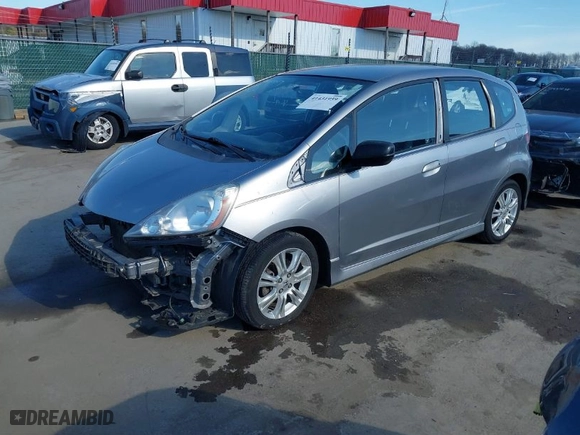 2009 Honda Fit Sport w/Navi with VIN JHMGE88629S018457, listed as a IAAI auction lot 41431959 with 165,213 mi miles. Bid and sale history available at carsss.com. Image 2.