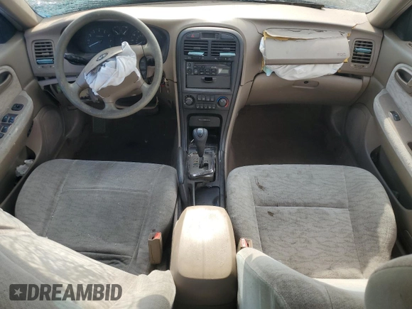 2006 Kia Optima LX z VIN KNAGD126865452524, wystawiony jako Copart lot #59813015 z przebiegiem 130 090 mil mil oraz Szkoda całkowita • Salvage title. Historia ofert i sprzedaży dostępna na DreamBid. Obrazek 8.