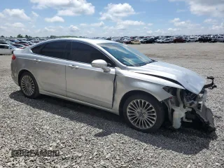 2016 Ford Fusion Titanium z VIN 3FA6P0D94GR181179, wystawiony jako Copart lot #56987005 z przebiegiem 79 841 mil mil oraz Czysty tytuł • Clean title. Historia ofert i sprzedaży dostępna na DreamBid. Obrazek 4.