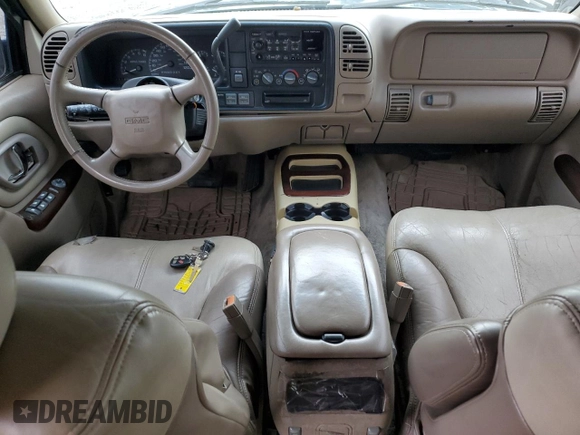 1999 GMC Denali z VIN 1GKEK13R6XR918944, wystawiony jako Copart lot #46049675 z przebiegiem 140 826 mil mil oraz Tytuł czysty. Historia ofert i sprzedaży dostępna na DreamBid. Obrazek 8.