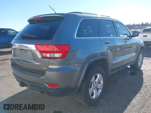 2011 Jeep Grand Cherokee Laredo with VIN 1J4RR4GG9BC714325, listed as a IAAI auction lot 41560915 with 153,372 mi miles and . Bid and sale history available at DreamBid. Image 4.