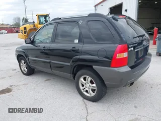 2007 Kia Sportage LX with VIN KNDJE723077397667, listed as a IAAI auction lot 42011122 with 218,744 mi miles and . Bid and sale history available at carsss.com. Image 3.