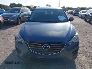 2016 Mazda CX-5 Sport with VIN JM3KE2BY8G0864983, listed as a IAAI auction lot 42072385 with 141,104 mi miles. Bid and sale history available at carsss.com. Image 12.