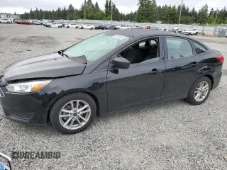 2018 Ford Focus SE z VIN 1FADP3FEXJL288116, wystawiony jako Copart lot #59629655 z przebiegiem 105 461 mil mil oraz Czysty tytuł • Clean title. Historia ofert i sprzedaży dostępna na DreamBid. Obrazek 1.