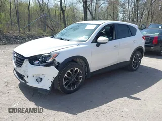 2016 Mazda CX-5 Grand Touring with VIN JM3KE4DY0G0632693, listed as a IAAI auction lot 42123142 with 106,592 mi miles. Bid and sale history available at carsss.com. Image 17.