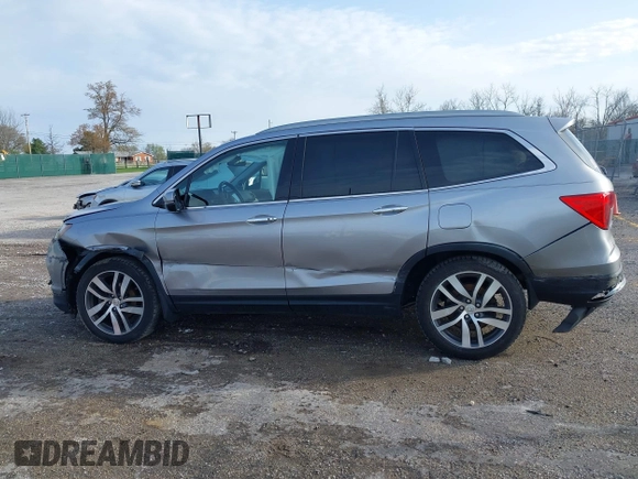 2016 Honda Pilot Touring with VIN 5FNYF6H90GB024902, listed as a IAAI auction lot 41948563 with 148,598 mi miles. Bid and sale history available at carsss.com. Image 14.