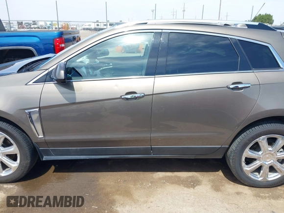 2016 Cadillac SRX Performance Collection z VIN 3GYFNCE39GS512286, wystawiony jako IAAI lot #42392467 z przebiegiem 95 708 mil mil oraz . Historia ofert i sprzedaży dostępna na DreamBid. Obrazek 14.
