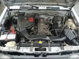 1992 Nissan Frontier z VIN 1N6SD11S8NC322357, wystawiony jako Copart lot #86761454 z przebiegiem 224 999 mil mil oraz Czysty tytuł • Clean title. Historia ofert i sprzedaży dostępna na DreamBid. Obrazek 13.