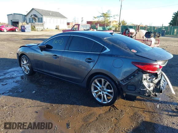 2014 Mazda 6 i Grand Touring with VIN JM1GJ1W50E1107877, listed as a IAAI auction lot 41857596 with 166,188 mi miles and . Bid and sale history available at DreamBid. Image 3.