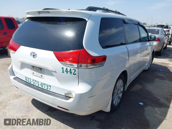 2014 Toyota Sienna LE with VIN 5TDJK3DC5ES081232, listed as a IAAI auction lot 41789629 with 397,033 mi miles and . Bid and sale history available at DreamBid. Image 4.