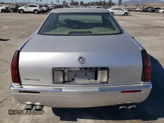 1999 Cadillac Eldorado z VIN 1G6EL12Y0XU604529, wystawiony jako Copart lot #77620004 z przebiegiem 246 032 mil mil oraz Szkoda całkowita • Salvage title. Historia ofert i sprzedaży dostępna na DreamBid. Obrazek 6.