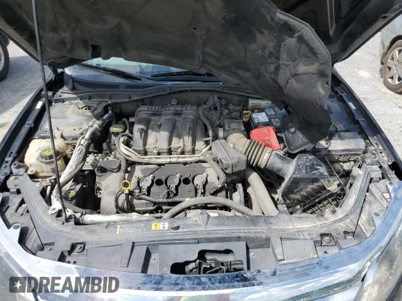 2012 Ford Fusion SEL z VIN 3FAHP0JG4CR388483, wystawiony jako Copart lot #57391805 z przebiegiem 184 665 mil mil oraz Szkoda całkowita • Salvage title. Historia ofert i sprzedaży dostępna na DreamBid. Obrazek 11.