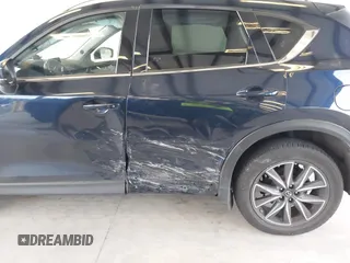 2018 Mazda CX-5 Grand Touring with VIN JM3KFBDM4J0302870, listed as a IAAI auction lot 41934217 with 57,151 mi miles. Bid and sale history available at carsss.com. Image 6.