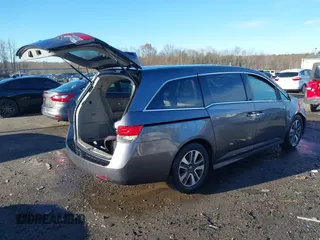 2014 Honda Odyssey Touring with VIN 5FNRL5H94EB081267, listed as a IAAI auction lot 41199509 with 146,827 mi miles and . Bid and sale history available at DreamBid. Image 4.
