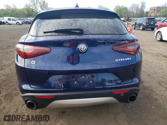 2018 Alfa Romeo Stelvio Sport z VIN ZASFAKPN8J7B69591, wystawiony jako Copart lot #54693475 z przebiegiem 98 148 mil mil oraz Szkody całkowita. Historia ofert i sprzedaży dostępna na DreamBid. Obrazek 6.