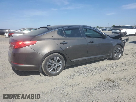 2013 Kia Optima EX z VIN 5XXGN4A77DG199443, wystawiony jako Copart lot #62406035 z przebiegiem 171 081 mil mil oraz Szkoda całkowita • Salvage title. Historia ofert i sprzedaży dostępna na DreamBid. Obrazek 3.