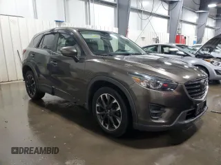 2016 Mazda CX-5 Grand Touring with VIN JM3KE4DY4G0600877, listed as a Copart auction lot 85560194 with 82,395 mi miles and Salvage Title. Bid and sale history available at carsss.com. Image 4.