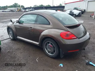 2012 Volkswagen Beetle 2.5L PZEV with VIN 3VWJP7AT2CM638265, listed as a IAAI auction lot 42512449 with 137,129 mi miles and . Bid and sale history available at DreamBid. Image 3.