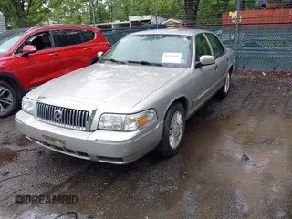 2010 Mercury Grand Marquis LS z VIN 2MEBM7FV5AX606629, wystawiony jako IAAI lot #42345444 z przebiegiem 66 600 mil mil oraz . Historia ofert i sprzedaży dostępna na DreamBid. Obrazek 2.