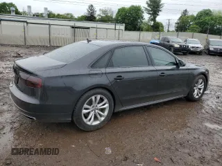 2017 Audi A8 z VIN WAU44AFD0HN004258, wystawiony jako Copart lot #55283985 z przebiegiem 128 059 mil mil oraz Szkoda całkowita • Salvage title. Historia ofert i sprzedaży dostępna na DreamBid. Obrazek 3.