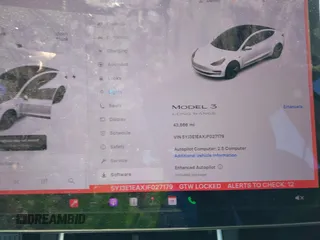 2018 Tesla Model 3 Long Range Battery with VIN 5YJ3E1EAXJF027179, listed as a IAAI auction lot 42059918 with 43,566 mi miles. Bid and sale history available at carsss.com. Image 7.