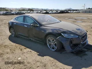 2013 Tesla Model S with VIN 5YJSA1AC9DFP10400, listed as a Copart auction lot 59047985 with 165,166 mi miles and Salvage title. Bid and sale history available at DreamBid. Image 4.