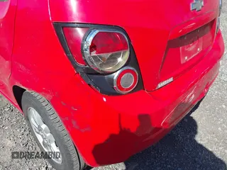 2014 Chevrolet Sonic LT with VIN 1G1JC6SG1E4129835, listed as a IAAI auction lot 42080133 with 94,170 mi miles. Bid and sale history available at carsss.com. Image 6.