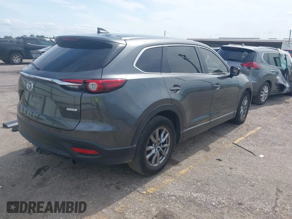 2019 Mazda CX-9 Sport with VIN JM3TCABY0K0327361, listed as a IAAI auction lot 42362232 with 264,699 mi miles and . Bid and sale history available at DreamBid. Image 4.