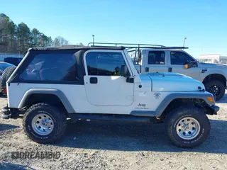 2005 Jeep Wrangler Unlimited with VIN 1J4FA44SX5P316055, listed as a IAAI auction lot 41586898 with 218,181 mi miles. Bid and sale history available at carsss.com. Image 13.