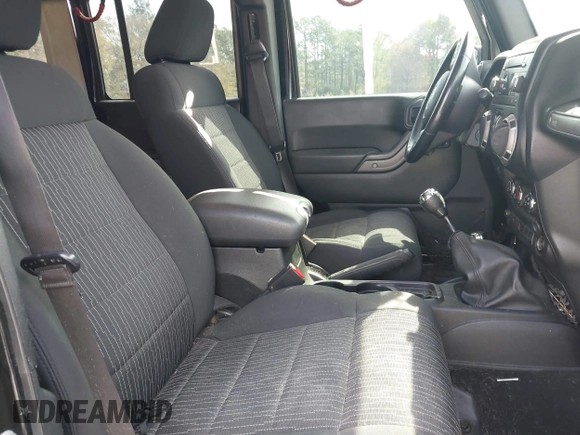 2012 Jeep Wrangler Unlimited Sport with VIN 1C4BJWDG2CL258264, listed as a IAAI auction lot 41880235 with 173,661 mi miles. Bid and sale history available at carsss.com. Image 5.
