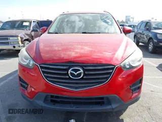 2016 Mazda CX-5 Sport with VIN JM3KE2BY4G0701442, listed as a IAAI auction lot 41682335 with 125,624 mi miles. Bid and sale history available at carsss.com. Image 13.