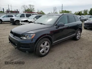 2012 Volkswagen Touareg Sport z VIN WVGFF9BP8CD001039, wystawiony jako Copart lot #57764125 z przebiegiem 128 540 mil mil oraz Czysty tytuł • Clean title. Historia ofert i sprzedaży dostępna na DreamBid. Obrazek 1.