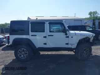 2014 Jeep Wrangler Unlimited Rubicon X with VIN 1C4BJWFG6EL240849, listed as a IAAI auction lot 42216082 with 118,912 mi miles and . Bid and sale history available at DreamBid. Image 13.
