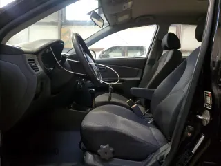 2010 Kia Rio with VIN KNADH4B37A6641845, listed as a Copart auction lot 51861215 with 163,894 mi miles and Salvage Title. Bid and sale history available at DreamBid. Image 7.