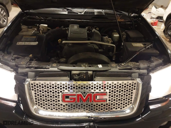 2004 GMC Envoy SLE with VIN 1GKDT13S542265104, listed as a IAAI auction lot 41884797 with 154,190 mi miles. Bid and sale history available at carsss.com. Image 10.