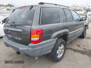 2004 Jeep Grand Cherokee Laredo with VIN 1J4GX48S34C214485, listed as a IAAI auction lot 42208120 with 164,322 mi miles and . Bid and sale history available at DreamBid. Image 4.