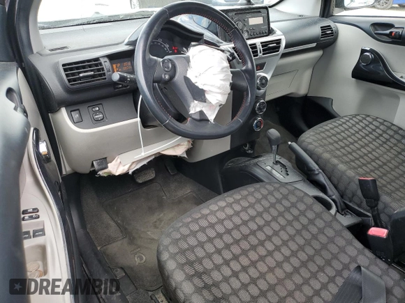 2012 Scion iQ z VIN JTNJJXB06CJ009187, wystawiony jako Copart lot #56563665 z przebiegiem 105 014 mil mil oraz Szkoda całkowita • Salvage title. Historia ofert i sprzedaży dostępna na DreamBid. Obrazek 8.