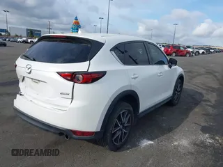 2018 Mazda CX-5 Grand Touring with VIN JM3KFADMXJ0470846, listed as a IAAI auction lot 41913533 with 54,700 mi miles and . Bid and sale history available at DreamBid. Image 4.