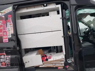 2023 Ford Transit Cargo with VIN 1FTBR3XG9PKA31930, listed as a IAAI auction lot 41397621 with 62,874 mi miles and . Bid and sale history available at DreamBid. Image 8.