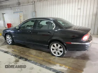 2003 Jaguar X-Type 3.0L z VIN SAJEA51C33WD25630, wystawiony jako Copart lot #57795475 z przebiegiem 135 514 mil mil oraz Szkody całkowita. Historia ofert i sprzedaży dostępna na DreamBid. Obrazek 2.