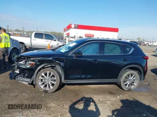 2020 Mazda CX-5 Grand Touring with VIN JM3KFBDM0L0790508, listed as a IAAI auction lot 41883319 with 114,398 mi miles and . Bid and sale history available at carsss.com. Image 14.