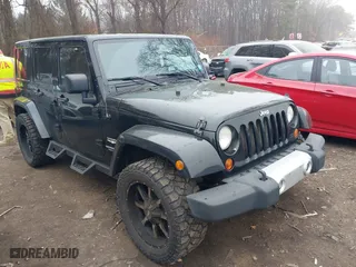 2011 Jeep Wrangler Unlimited Sahara with VIN 1J4BA5H10BL577011, listed as a IAAI auction lot 41925302 with 165,248 mi miles. Bid and sale history available at carsss.com. Image 1.
