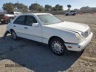 1999 Mercedes-Benz E-Class with VIN WDBJF65H6XA762532, listed as a Copart auction lot 79925364 with 196,487 mi miles and Salvage Title. Bid and sale history available at carsss.com. Image 4.