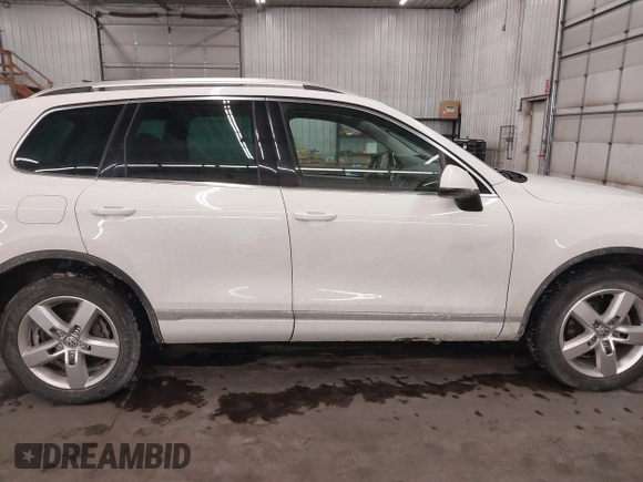 2013 Volkswagen Touareg Lux with VIN WVGEF9BP5DD011511, listed as a IAAI auction lot 41608840 with 167,350 mi miles and . Bid and sale history available at DreamBid. Image 14.