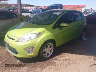 2011 Ford Fiesta SES with VIN 3FADP4FJ9BM119319, listed as a IAAI auction lot 42025691 with 104,516 mi miles. Bid and sale history available at carsss.com. Image 2.