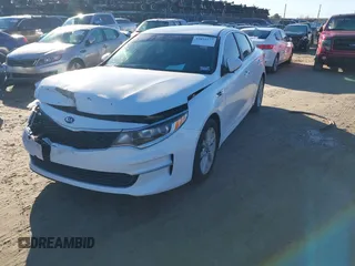 2016 Kia Optima LX with VIN 5XXGT4L36GG005859, listed as a IAAI auction lot 41053277 with 127,783 mi miles. Bid and sale history available at carsss.com. Image 20.